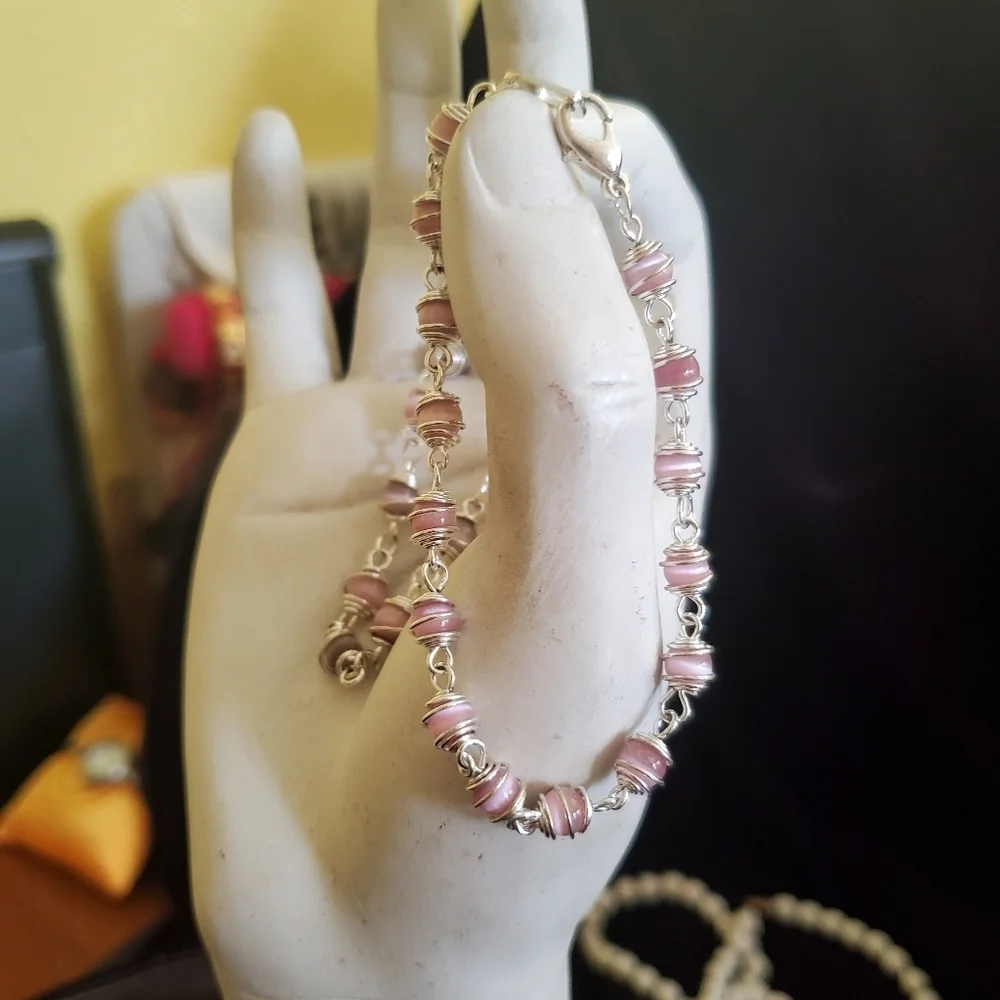 Two silver with pink pearl stones